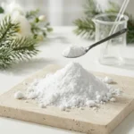 SymWhite 377 Phenylethyl Resorcinol high-purity crystalline powder for skincare formulation on a stone surface.